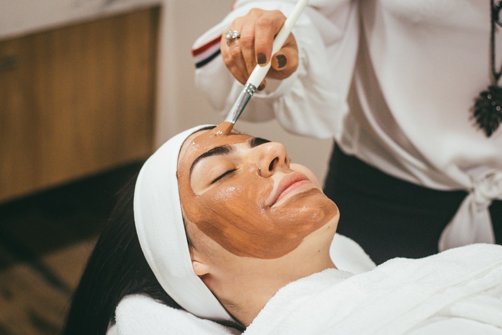 Woman applying skincare serum